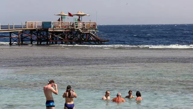 epa08698417 Tourists spend time on the beach at a leisure resort in the city of Sharm El-Sheikh, Egypt, 26 September 2020. All passengers arriving to Egypt airports are required to provide a negative PCR test for coronavirus as of 01 September. However foreign tourists landing at Hurghada, Sharm El-Sheikh, Marsa Alam can undergo the test upon arrival at the airports for 30 US dollars. EPA/KHALED ELFIQI