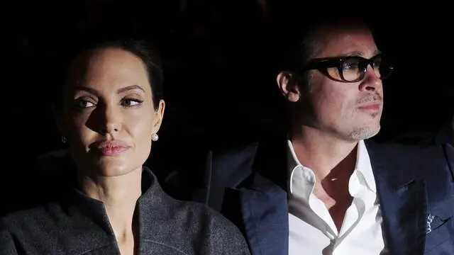 epa04253562 US actress Angelina Jolie (L) and US actor Brad Pitt (R) arrive for the Global Summit to End Sexual Violence in Conflict at the Excel Center in London, Britain, 13 June 2014. The summit ends on 13 June. EPA/FACUNDO ARRIZABALAGA