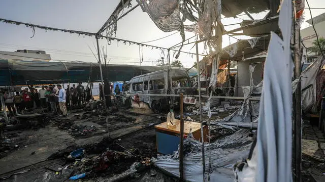 epa11657950 Palestinians survey the damage at a camp for internally displaced people on the premises of al-Aqsa Hospital, after the area was hit by an Israeli air strike, in Deir al Balah, central Gaza Strip, 14 October 2024. According to the Palestinian Ministry of Health, four people were killed as a result of the strike on al-Asqa hospital, and several dozens were wounded. More than 42,200 Palestinians and over 1,400 Israelis have been killed, according to the Palestinian Health Ministry and the Israeli Army, Tsahal, since Hamas militants launched an attack against Israel from the Gaza Strip on 07 October 2023, and the Israeli operations in Gaza and the West Bank which followed it. EPA/MOHAMMED SABER