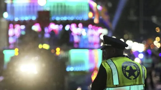 epa05815572 A member of the New Orleans Police Department (NOPD) works the parade route as the Krewe of Endymion Mardi Gras Parade rolls in New Orleans, Louisiana, USA, 25 February 2017. According to reports, dozens of people were injured after a pickup truck slammed into a crow in the Mid-City section of New Orleans during a parade on 25 February 2017. A man was taken into custody and police was said to investigate the suspect for driving while intoxicated, media added. New Orleans is celebrating Mardi Gras leading up to the last day of Carnival on Fat Tuesday. EPA/DAN ANDERSON