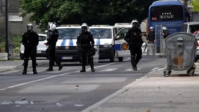 epa09448735 Montenegro riot police guard road during a protest against the enthronement of the Serbian Orthodox bishop in Cetinje, Montenegro, 05 September 2021. The enthronement of the new bishop of the Serbian Orthodox Church in Montenegro is causing a divide in Montenegro, sparking tensions between the members of the Serbian orthodox church and protestors who are opposing the ceremony taking place in the former Montenegrin royal capital. EPA/BORIS PEJOVIC