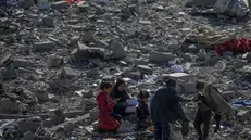 epa11803407 Palestinians inspect the destroyed house of the Abu Libda family following an Israeli air strike in Al Maghazi refugee camp, central Gaza Strip, 03 January 2025. According to reports from the Ministry of Health in Gaza at least nine members of the Abu Libda family were killed following an Israeli air strike in the refugee camp. More than 45,500 Palestinians and over 1,400 Israelis have been killed, according to the Palestinian Health Ministry and the Israeli Army, since Hamas militants launched an attack against Israel from the Gaza Strip on 07 October 2023 and the Israeli operations in Gaza and the West Bank that followed it. EPA/MOHAMMED SABER