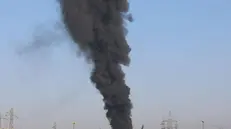 epa11079608 Flames and smoke rise from a power station in Qamishli town, northeast Syria, 15 January 2024. Syrian state-media said Turkish drone targeted locations in northern Syria, adding that transformer stations in Qamishli went out of service. Turkey on 14 January announced targeting Kurdish sites in northern Iraq and Syria they suspect to have links to the Kurdistan Workers Party (PKK), after the death of nine Turkish soldiers in an attack in northern Iraq. EPA/AHMED MARDNLI