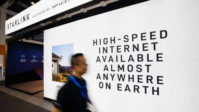 epa11588982 A visitor passes by the booth of Starlink by SpaceX during the opening day of the 100th IFA trade fair in Berlin, Germany, 06 September 2024. The IFA, the world's largest trade show for consumer electronics and home appliances, celebrates its 100th anniversary and takes place from 06 to 10 September 2024. EPA/CLEMENS BILAN