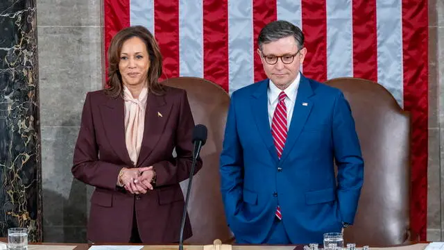 epa11810084 US Vice President Kamala Harris (L) stands next to Speaker of the House Mike Johnson (R) in the House chamber of the US Capitol as lawmakers gather to certify President-elect Trump's election victory in Washington, DC, USA, 06 January 2025. The certification comes exactly four years after a mob of Trump-supporting insurrectionists stormed the Capitol, attempting to disrupt the certification of US President Joe Biden. EPA/SHAWN THEW