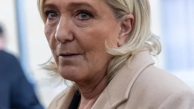 epa11739382 French member of parliament and leader of the Rassemblement National far-right party Marine Le Pen speaks to the media after a meeting with French Prime Minister Michel Barnier (not pictured) at Matignon in Paris, France, 25 November 2024. The French Prime Minister is holding meetings with parliament group leaders. EPA/CHRISTOPHE PETIT TESSON