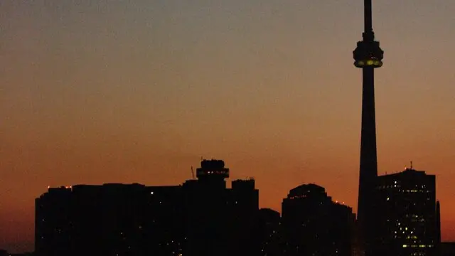 The skyline of Toronto Canada in darkness because of an electrical power black out throughout parts of north-eastern sea board of North America, on Thursday 14 August 2003. A major blackout left New York and cities acrossthe north eastern United States and south eastern Canada without powerThursday, causing traffic chaos, trapping people in dark subwaytrains and elevators, and shutting down airports and nuclear plants. Hundreds of thousands of people flooded onto Manhattan streetsafter the outage, which hit shortly after 4 p.m. (2000 GMT) on a hotsummer day, knocking out traffic lights as the evening rush hour wasgetting under way and leaving skyscrapers, hospitals and homeswithout electricity. EPA PHOTO/EPA/Warren Toda