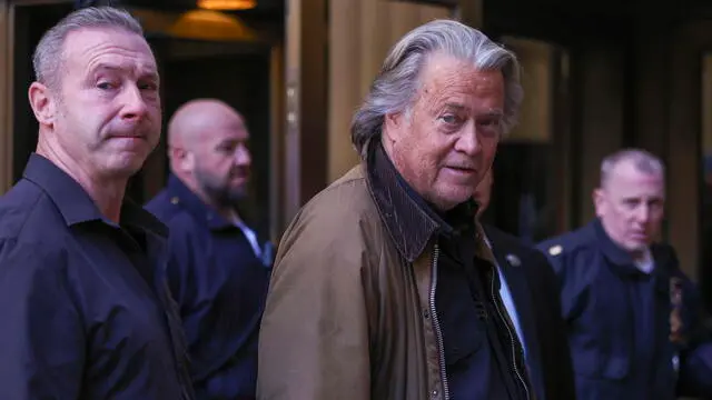 epa11717029 Former Trump Advisor Steve Bannon (C) speaks to the press on his way to appear in a hearing before an upcoming trial on criminal fraud charges, in New York, New York, USA, 12 November 2024. EPA/SARAH YENESEL