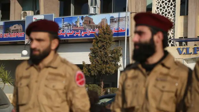 epa11783697 Military Police personnel stand at Aleppo Airport, which has reopened for the first time since the ouster of president Bashar al-Assad, Aleppo, Syria, 18 December 2024. A Syrian Air Airbus took off from Damascus Airport to Aleppo in the countryâ€™s north for the first time since opposition forces seized the capital, toppling president Bashar al-Assad on 08 December. EPA/BILAL AL HAMMOUD