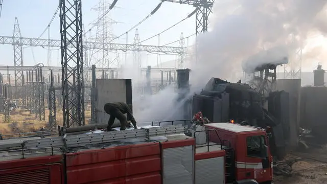 epa11784831 Firefighters extinguish the fire after Israeli airstrikes targeted a power station in Sana'a, Yemen, 19 December 2024. Israeli airstrikes have targeted several sites in the Houthis-controlled Yemeni cities of Sana'a and Hodeidah, resulting in the deaths of at least nine people, shortly after the Houthis launched a missile attack on Israel, according to Houthis-run media. Israel's military said they conducted 'precise strikes on Houthi military targets in Yemen including ports and energy infrastructure in Sana'a'. EPA/YAHYA ARHAB