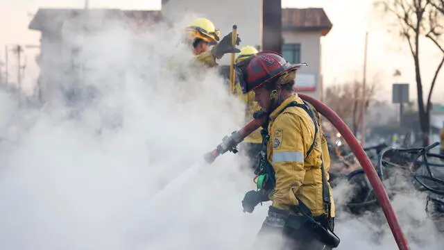 epa11817725 Firefighters hose down the burning remains of a structure in Altadena, California, USA, 10 January 2025. Multiple wildfires continue to burn across thousands of acres in Southern California, destroying thousands of homes and forcing people to evacuate areas throughout the Los Angeles area. According to the California Governorâ€™s office, more than 7,500 firefighting and emergency personnel are involved in response efforts. EPA/CAROLINE BREHMAN