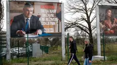 epa11814550 People pass in front of an election poster of presidential candidate and incumbent President of Croatia, Zoran Milanovic, in Zagreb, Croatia, 09 January 2025. Croatia will hold the second round of presidential elections on 12 January 2025. EPA/ANTONIO BAT