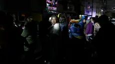 epa11819746 People gather in the street following an earthquake in Mexico City, Mexico, 12 January 2025. According to the Mexican National Seismological Service (SSN), a 6.1 magnitude earthquake hit 47 km southwest of Coalcoman, Michoacan State, early 12 January, followed by up to 37 aftershocks, which were felt in several parts of the country. EPA/MARIO GUZMAN