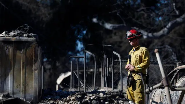 epa11822577 Firefighters and Search and Rescue teams inspect the site of a burned down home in Altadena, California, USA, 13 January 2025. Various teams have been deployed to not only look for hazards and firehot spots, but also identify if there are human remains. As of the morning of 13 January, the number of confirmed deaths from the Palisades and Eaton fires is 25, with eight of the fire victims from the Palisades fire and 17 from the Eaton fire in Altadena, according to the Los Angeles County medical examiner and Sheriff Robert Luna. EPA/CAROLINE BREHMAN