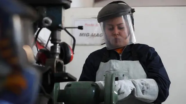 epa09060036 Ines Louihik, 26-years old welder works in a welding workshop in Tunis, Tunisia, 05 March 2021 (Issued on 07 March 2021). Ines says: 'In 2019, I passed the welding exam, I was the only woman with 35 men. It is very difficult to be accepted as a woman, many people think that welding is hard work exclusively for men but I have proven that women can be welders too and I am very proud of myself. EPA/MOHAMED MESSARA