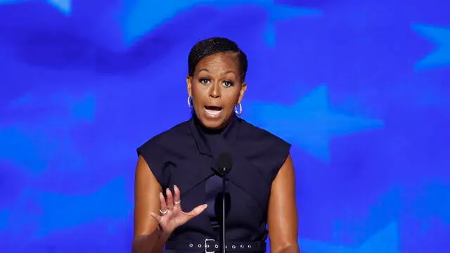 epa11557478 Former First Lady of the US Michelle Obama speaks during the second night of the Democratic National Convention (DNC) at the United Center in Chicago, Illinois, USA, 20 August 2024. The 2024 Democratic National Convention is being held from 19 to 22 August 2024, during which delegates of the United States' Democratic Party will vote on the party's platform and ceremonially vote for the party's nominee for president, Vice President Kamala Harris, and for vice president, Governor Tim Walz of Minnesota, for the upcoming presidential election. EPA/CAROLINE BREHMAN