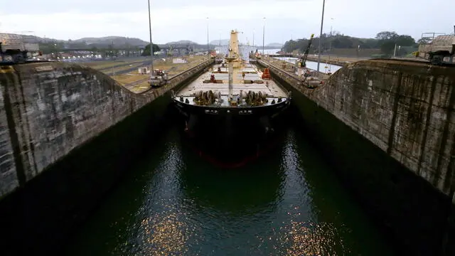 epa11242925 A ship transits through the Panama Canal, in Panama City, Panama, 22 March 2024 (issued 25 March 2024). Transits through the Panama Canal increase to 27 daily, after a reduction, due to the drought, which is impacting international maritime trade at a time when it is also affected by the crisis in the Red Sea. EPA/Carlos Lemos