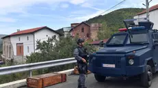 epa10885614 Armed Kosovo Police officers stand guard outside the Banjska Monastery in the village of Banjska, Kosovo, 27 September 2023. A Kosovar Albanian police officer on 24 September was killed by Serb gunmen who later barricaded themself in the XIV century Serbian Orthodox Banjska monastery and traded gunfire for hours, Kosovo authorities confirmed. Police regained control of the area late on the same day. The incident came at a fragile moment in the Kosovo - Serbia European Union-facilitated dialogue to normalize ties between the two parties. EPA/GEORGI LICOVSKI