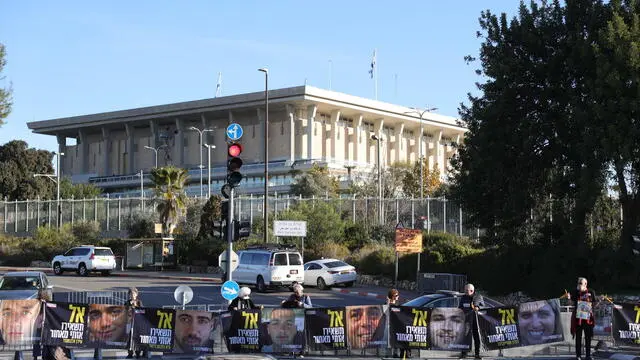 epa11823043 Protesters holding pictures of Israeli hostages held by Hamas in Gaza demonstrate outside the Israeli Knesset, the Israeli parliament, calling for their release in Jerusalem, 14 January 2025. According to the Israeli army (IDF) spokesperson, around 100 Israeli hostages remain in captivity in the Gaza Strip, including the bodies of 33 confirmed dead. EPA/ABIR SULTAN