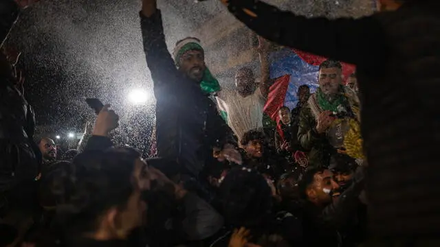 epa11826771 Palestinians react to news of a ceasefire agreement with Israel, in Khan Younis, southern Gaza Strip, January 15, 2025. According to US and Hamas officials, Israel and Hamas agreed on a hostage deal and ceasefire, to be implemented in the coming days. EPA/HAITHAM IMAD