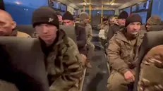 epa11799192 A still image taken from a handout video made available by the Russian Defence Ministry Press-Service shows Russian soldiers in a bus after being released in a prisoner swap between Russia and Ukraine, at an undisclosed location in Belarus, 30 December 2024. The Russian Ministry of Defense announced that as a result of negotiations, 150 Russian servicemen were returned from Ukrainian captivity. In exchange, 150 prisoners of war (POWs) of the Ukrainian Armed Forces were transferred to Ukraine. EPA/RUSSIAN DEFENCE MINISTRY PRESS SERVICE HANDOUT -- MANDATORY CREDIT -- BEST QUALITY AVAILABLE -- HANDOUT EDITORIAL USE ONLY/NO SALES