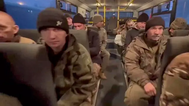 epa11799192 A still image taken from a handout video made available by the Russian Defence Ministry Press-Service shows Russian soldiers in a bus after being released in a prisoner swap between Russia and Ukraine, at an undisclosed location in Belarus, 30 December 2024. The Russian Ministry of Defense announced that as a result of negotiations, 150 Russian servicemen were returned from Ukrainian captivity. In exchange, 150 prisoners of war (POWs) of the Ukrainian Armed Forces were transferred to Ukraine. EPA/RUSSIAN DEFENCE MINISTRY PRESS SERVICE HANDOUT -- MANDATORY CREDIT -- BEST QUALITY AVAILABLE -- HANDOUT EDITORIAL USE ONLY/NO SALES