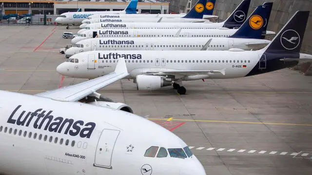 epa11215797 Lufthansa planes are seen stationed, at Frankfurt Airport, in Frankfurt am Main, Germany, 12 March 2024. The UFO cabin crew union has called on its members to strike, to press their demands for better wages. According to Lufthansa, 100,000 passengers should be affected by a two day strike in Frankfurt and Munich airport. EPA/ANDRE PAIN