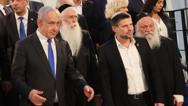 epa11391402 Israeli Prime Minister Benjamin Netanyahu (L) poses next to Minister of Finance Bezalel Smotrich (C-R) and other cabinet members prior to a cabinet meeting at the Bible Lands Museum in Jerusalem, 05 June 2024. EPA/GIL COHEN-MAGEN / POOL