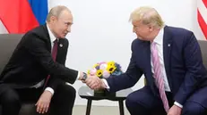 epa07679922 A handout picture made available on official website of President of Russia, shows Russian President Vladimir Putin (L) shaking hands with US President Donald J. Trump (R) during their meeting on the sidelines of the G20 summit in Osaka, Japan, 28 June 2019. In the first time Japan hosts a G20 summit. The summit gathers leaders from 19 countries and the European Union to discuss topics such as global economy, trade and investment, innovation and employment. EPA/RUSSIAN PRES. PRESS OFFICE / HANDOUT HANDOUT EDITORIAL USE ONLY/NO SALES