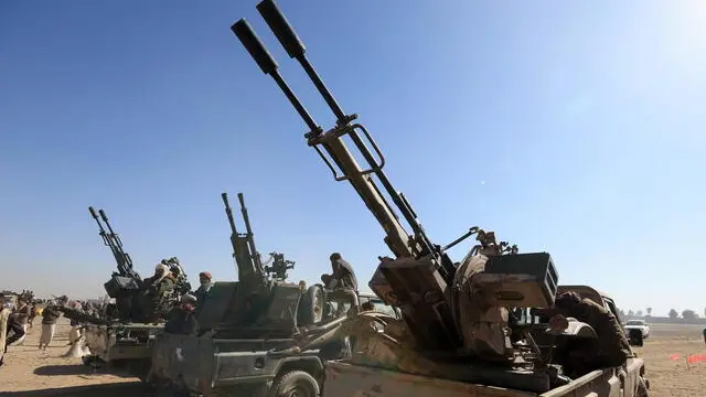 epa11828137 Armed tribesmen ride vehicles with machine guns during an anti-USA and anti-Israel gathering mobilizing more Houthi fighters, on the outskirts of Sana'a, Yemen, 16 January 2025. Yemen's Houthis have been recruiting more fighters as part of a mobilization campaign for a possible confrontation with the United States and Israel amid an escalation of Houthi missile-drone attacks on Israel and shipping lanes in the seas around Yemen in retaliation for Israel's military operation in Gaza. EPA/YAHYA ARHAB