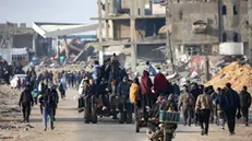 epa11835528 Internally displaced Palestinians on their way to Rafah as they leave areas near Khan Yunis, where they had taken refuge, in the southern Gaza Strip, 19 January 2025. Israel and Hamas agreed on a hostage release deal and a Gaza ceasefire to be implemented on 19 January 2025. More than 46,000 Palestinians have been killed in the Gaza Strip, according to the Palestinian Ministry of Health, since Israel launched a military campaign in the strip in response to a cross-border attack led by the Palestinian militant group Hamas on 07 October 2023, in which about 1,200 Israelis were killed and more than 250 taken hostage. EPA/HAITHAM IMAD