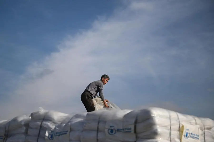 epa11836833 A truck driver prepares his truck of humanitarian aid bound for the Gaza Strip that will cross the Rafah border crossing between the Gaza Strip and Egypt, in Rafah, Egypt, 19 January 2024, after announcement of a ceasefire agreement between Israel and Hamas. More than 46,000 Palestinians have been killed in the Gaza Strip, according to the Palestinian Ministry of Health, since Israel launched a military campaign in the strip in response to a cross-border attack led by the Palestinian militant group Hamas on 07 October 2023, in which about 1,200 Israelis were killed and more than 250 taken hostage. EPA/MOHAMED HOSSAM