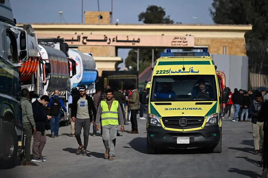 epa11836829 Trucks of humanitarian aid bound for the Gaza Strip at the Rafah border crossing between the Gaza Strip and Egypt, in Rafah, Egypt, 19 January 2024, after the announcement of a ceasefire agreement between Israel and Hamas. More than 46,000 Palestinians have been killed in the Gaza Strip, according to the Palestinian Ministry of Health, since Israel launched a military campaign in the strip in response to a cross-border attack led by the Palestinian militant group Hamas on 07 October 2023, in which about 1,200 Israelis were killed and more than 250 taken hostage. EPA/MOHAMED HOSSAM