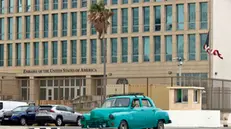 epa11826828 A classic US-made car drives past the US Embassy in Havana, Cuba, 15 January 2025. Cuban authorities clarified that the 553 people to be released from the island's prisons have neither been pardoned nor amnestied - but rather, technically, released from prison - and therefore 'may return to prison' if they do not meet a series of 'requirements', such as 'good conduct'. The Cuban government announced on 14 January the release of prisoners following negotiations with the Vatican. EPA/ERNESTO MASTRASCUSA