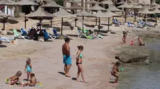 epa08698416 Tourists spend time on the beach at a leisure resort in the city of Sharm El-Sheikh, Egypt, 26 September 2020. All passengers arriving to Egypt airports are required to provide a negative PCR test for coronavirus as of 01 September. However foreign tourists landing at Hurghada, Sharm El-Sheikh, Marsa Alam can undergo the test upon arrival at the airports for 30 US dollars. EPA/KHALED ELFIQI