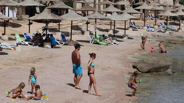 epa08698416 Tourists spend time on the beach at a leisure resort in the city of Sharm El-Sheikh, Egypt, 26 September 2020. All passengers arriving to Egypt airports are required to provide a negative PCR test for coronavirus as of 01 September. However foreign tourists landing at Hurghada, Sharm El-Sheikh, Marsa Alam can undergo the test upon arrival at the airports for 30 US dollars. EPA/KHALED ELFIQI