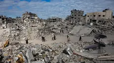 epa11837968 Internally displaced Palestinians walk along a street among the rubble of destroyed buildings amid a ceasefire between Israel and Hamas, in Rafah, southern Gaza Strip, 20 January 2025. Israel and Hamas implemented the first phase of a hostage release and ceasefire deal on 19 January 2025. More than 46,000 Palestinians have been killed in the Gaza Strip, according to the Palestinian Ministry of Health, since Israel launched a military campaign in the strip in response to a cross-border attack led by the Palestinian militant group Hamas on 07 October 2023, in which about 1,200 Israelis were killed and more than 250 taken hostage. EPA/HAITHAM IMAD