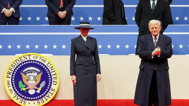 epa11840590 US President Donald Trump (R) and First Lady Melanie Trump arrive to address supporters gathered for an inauguration event at the Capitol One Arena in Washington, DC, USA, 20 January 2025. Earlier today Trump was sworn in for a second term as president of the United States in the rotunda of the US Capitol, though the ceremonies and events surrounding the presidential inauguration were moved indoors due to extreme cold temperatures. EPA/ALLISON DINNER