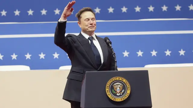 epa11840271 Tesla CEO Elon Musk gestures to the crowds at the Capitol One Arena after his address during inauguration ceremonies for US President Donald Trump in Washington, DC, USA, 20 January 2025. Trump was sworn in for a second term as president of the United States on 20 January. The presidential inauguration was held indoors due to extreme cold temperatures in DC. EPA/ALLISON DINNER