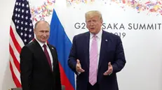 epa07679035 Russian President Vladimir Putin (L) and US President Donald J. Trump (R) meet on the sidelines of the G20 leaders summit in Osaka, Japan, 28 June 2019. The summit gathers leaders from 19 countries and the European Union to discuss topics such as global economy, trade and investment, innovation and employment. EPA/MICHAEL KLIMENTYEV/SPUTNIK/KREMLIN POOL