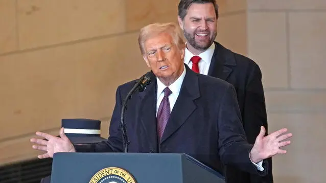 epa11840139 US President Donald Trump speaks to the crowd in Emancipation Hall as Vice-President JD Vance (Back) looks on at the US Capitol after Trump was sworn in as the 47th president of the United States in Washington, DC, USA, 20 January 2025. Trump was sworn in for a second term as president of the United States on 20 January. The presidential inauguration was held indoors due to extreme cold temperatures in DC. EPA/BONNIE CASH / POOL