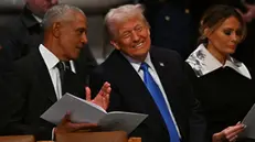 epa11815100 Former US President Barack Obama (L) and President-elect Donald Trump (C) speak ahead of the state funeral services for former US President Jimmy Carter at the National Cathedral in Washington, DC, USA, 09 January 2025. Carter, the 39th US president, died at age 100 in his hometown of Plains, Georgia, on 29 December 2024. EPA/RICKY CARIOTI / POOL