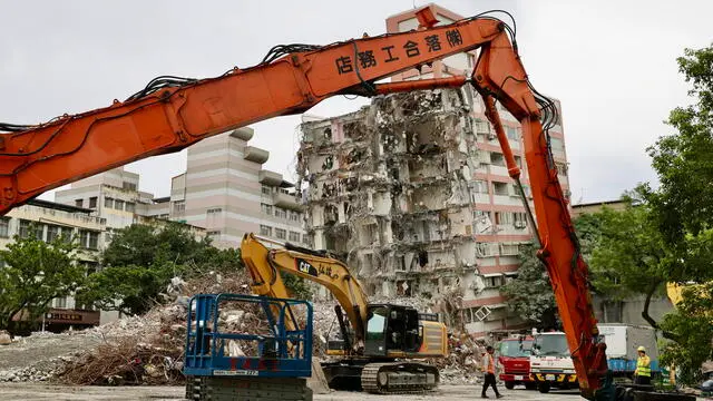 epaselect epa11315776 Taiwanese demolition workers prepare next to a partially collapsed building one month after a 7.2 magnitude earthquake hit Hualien, Taiwan, 03 May 2024. The Taiwan Foundation for Disaster Relief reported on April 28 that donations had reached approximately 1.4 billion New Taiwan dollars (42.92 million US dollars) following a severe earthquake on April 03. The earthquake resulted in extensive damage and loss of life, particularly in Hualien County near the epicenter. Casualty statistics from Hualien include 17 deaths, 247 injuries ranging from minor to serious, and 2 missing persons of Singaporean nationality. EPA/RITCHIE B. TONGO ATTENTION: This Image is part of a PHOTO SET