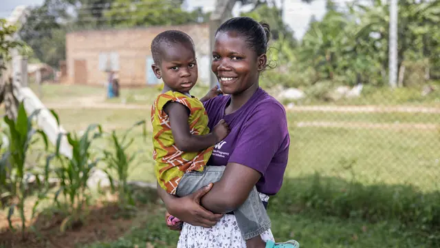 Esther Mutesi poses for a picture with her baby at the Kigalama Health Center III, Kigalama village, Namutumba rural sub county, on November 11, 2024.