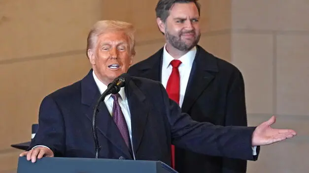 epa11840134 US President Donald Trump speaks to the crowd in Emancipation Hall as Vice-President JD Vance (Back) looks on at the US Capitol after Trump was sworn in as the 47th president of the United States in Washington, DC, USA, 20 January 2025. Trump was sworn in for a second term as president of the United States on 20 January. The presidential inauguration was held indoors due to extreme cold temperatures in DC. EPA/BONNIE CASH / POOL