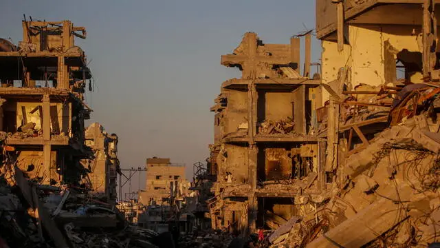 epa11839854 Palestinians inspect destroyed buildings in Rafah refugee camp, southern Gaza Strip, 20 January 2025, amid a ceasefire between Israel and Hamas. Israel and Hamas agreed on a hostage release deal and a Gaza ceasefire to be implemented on 19 January 2025. More than 46,000 Palestinians have been killed in the Gaza Strip, according to the Palestinian Ministry of Health, since Israel launched a military campaign in the strip in response to a cross-border attack led by the Palestinian militant group Hamas on 07 October 2023, in which about 1,200 Israelis were killed and more than 250 taken hostage. EPA/MOHAMMED SABER