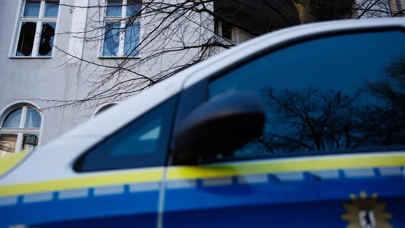 epa11802221 A police car stands in front of a pane of windows of a residential building that are in a destroyed state in Berlin, Germany, 02 January 2025. The Berlin fire department announced in a summary of the events on New Year's Eve in Berlin that 36 apartments became uninhabitable after the implementation of pyrotechnics around the Schoeneberg district street Belziger Strasse.Â EPA/CLEMENS BILAN