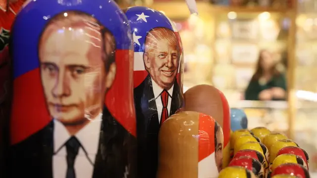 epa11842194 Traditional Russian Matryoshka dolls decorated with portraits of the Russian President Vladimir Putin (L) and the US President Donald Trump are on display at a souvenir shop in downtown Moscow, Russia, 21 January 2025. EPA/MAXIM SHIPENKOV