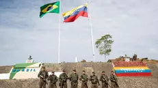 epa08215928 Soldiers of the Brazilian Army guard the border with Venezuela, in the city of Pacaraima, Brazil, 13 February 2020. During the last days, Brazilians protested at the points of the BR-174 road, at the entrance of the city of Pacaraima, with the support of indigenous peoples, about 500 meters from the border between the two countries, against the permanence of Venezuelans in Brazilian territory. EPA/Joedson Alves