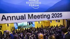 epa11847562 Participants queue up to enter the Congress Hall to see US President Donald Trump shown on screens as he addresses via videolink a plenary session during the 55th annual meeting of the World Economic Forum (WEF) in Davos, Switzerland, 23 January 2025. The World Economic Forum annual meeting brings together entrepreneurs, scientists, corporate and political leaders in Davos and takes place from January 20 to 24. EPA/MICHAEL BUHOLZER